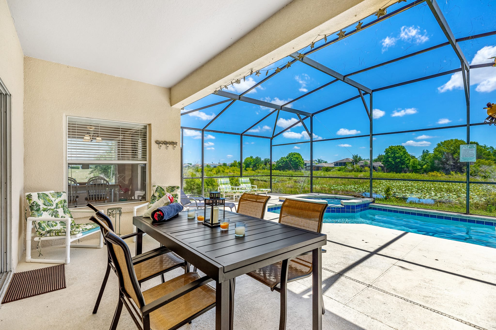 pool deck with lanai dining