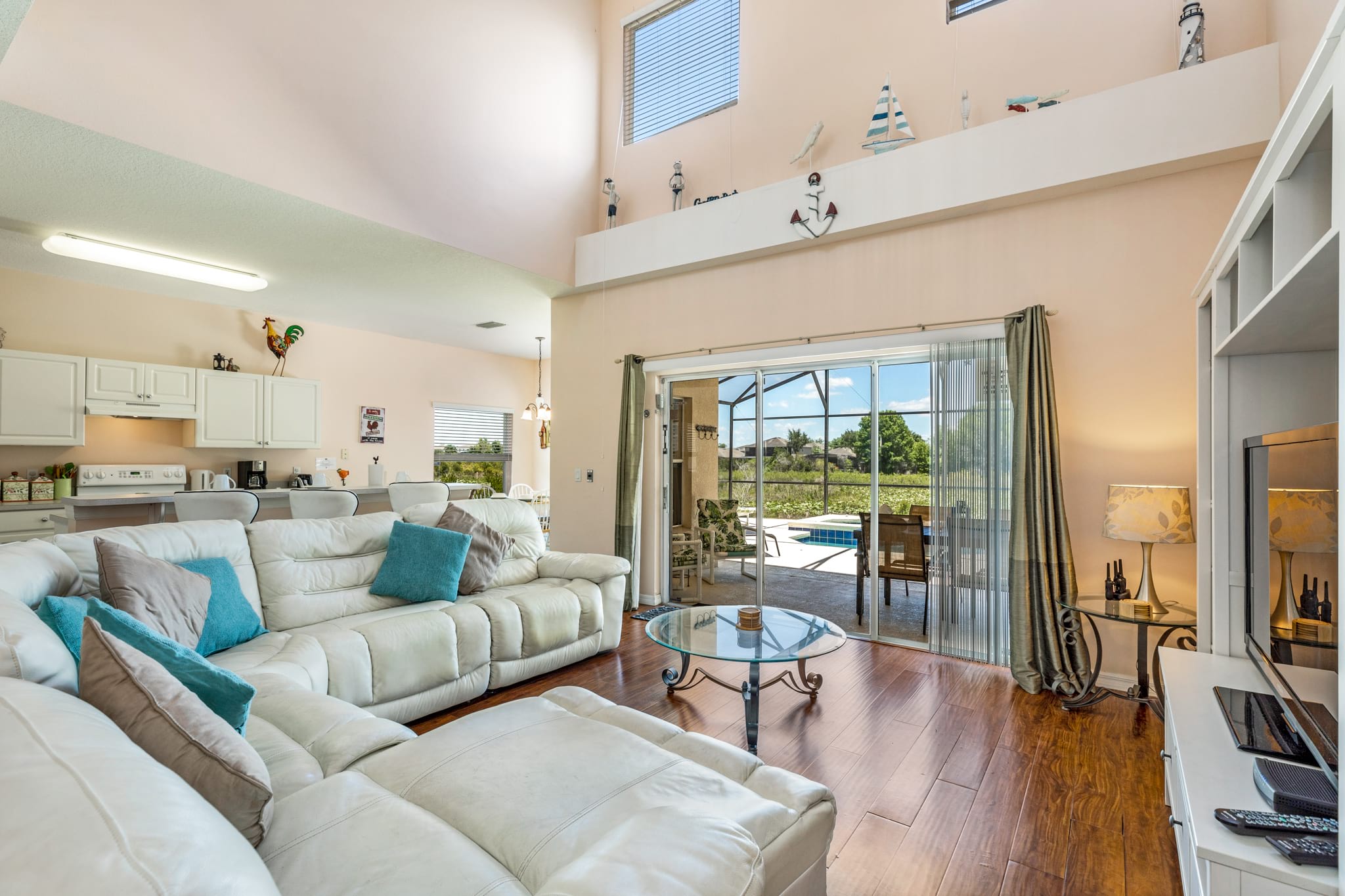 living room looks out to the pool